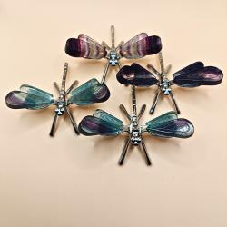 Guldsmed med fluorit vinger